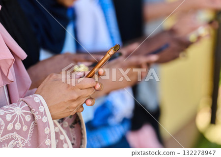 Diverse Teen Group Standing Together Against Wall Using Smartphones 132278947