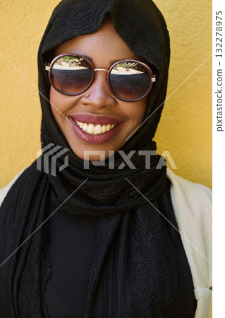 Close Up Portrait of Middle Eastern Muslim Woman Against Yellow Background Close Up Portrait of Middle Eastern Muslim Woman Against Yellow Background 132278975
