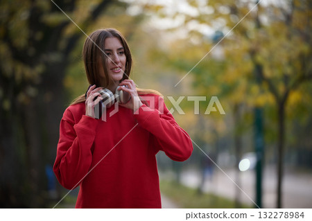 Athletic young woman taking a breath and relaxing after jogging and stretching. Woman Training and Workout Exercises On Street. Athletic young woman taking a breath and relaxing after jogging and stretching. Woman Training and Workout Exercises On Street. 132278984