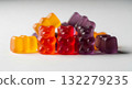 Group of red, orange and purple multivitamin gummies bears isolated on white background. Healthy lifestyle concept 132279235