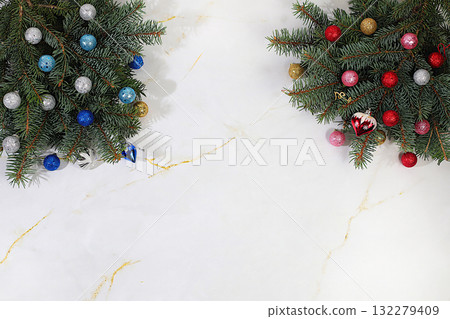Beautiful Christmas and New Year background with live fir branches, decorations and toys, product design for holiday advertising, Christmas Eve concept, Festive winter card and banner on the screen 132279409