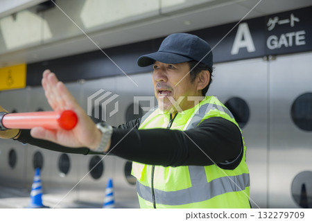 Security guards directing people through the event space 132279709