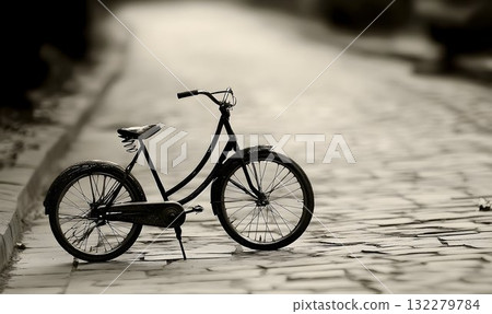 Vintage Bicycle on Cobblestone Street in Sepia Tone 132279784
