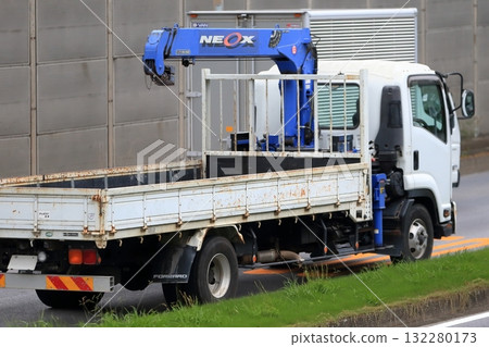 Unic vehicle (truck crane) in motion 132280173
