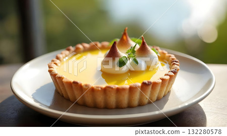 Delicious lemon meringue tart pie sweet pastry dessert on plate. This tasty food brings feelings of pure enjoyment Delicious lemon meringue tart pie sweet pastry dessert on plate. This tasty food brings feelings of pure enjoyment 132280578