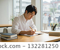 Male businessman writing in notebook / Image of studying, organizing ideas, working from home 132281250