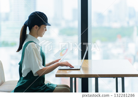 Restaurant staff doing clerical work on a computer Restaurant staff doing clerical work on a computer 132281286