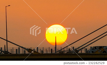 Oct 7 2025 Sunset Over Cable-Stayed Bridge At Dusk With Aircraft Silhouette Oct 7 2025 Sunset Over Cable-Stayed Bridge At Dusk With Aircraft Silhouette 132282529