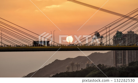 Oct 7 2025 Sunset Over Bridge With Silhouetted Bus, Cables, And Industrial Structures 132282530