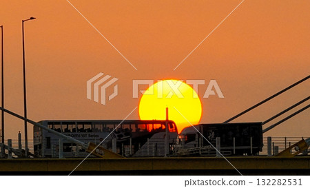 Oct 7 2025 Sunset Over Cable-Stayed Bridge At Dusk With Aircraft Silhouette 132282531