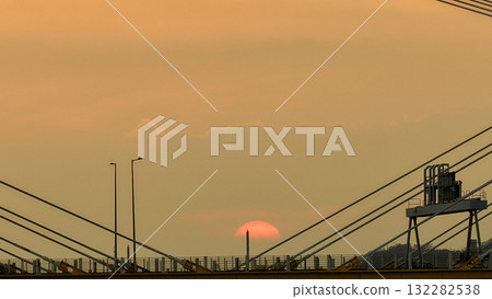 Oct 7 2025 Sunset Over Cable-Stayed Bridge At Dusk With Aircraft Silhouette Oct 7 2025 Sunset Over Cable-Stayed Bridge At Dusk With Aircraft Silhouette 132282538