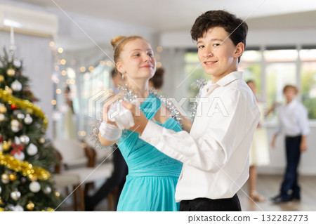 Boy and girl dancing waltz in studio Boy and girl dancing waltz in studio 132282773
