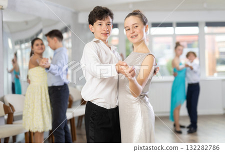 Boy and girl dancing waltz in studio 132282786