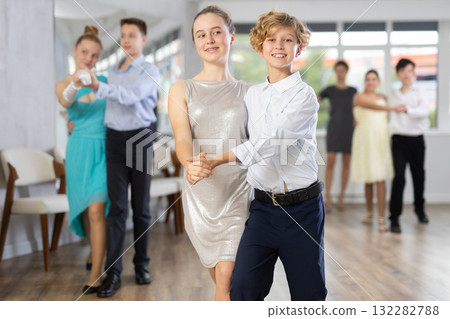 Boy and girl dancing waltz in studio Boy and girl dancing waltz in studio 132282788