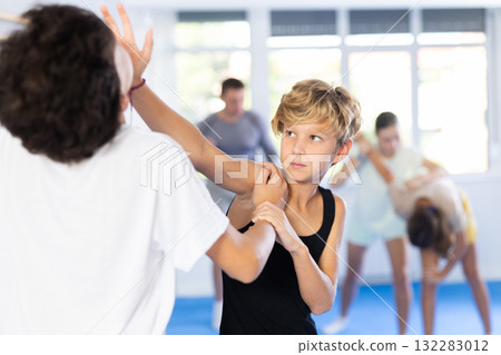 Two boys practicing self-defense techniques 132283012