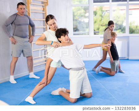 Boy and girl practicing self-defense techniques Boy and girl practicing self-defense techniques 132283036