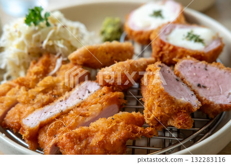 Sous vide pork katsu. Tonkatsu including loin, fillet and cheese katsu. Fried Pork serve on plate in restaurant 132283116