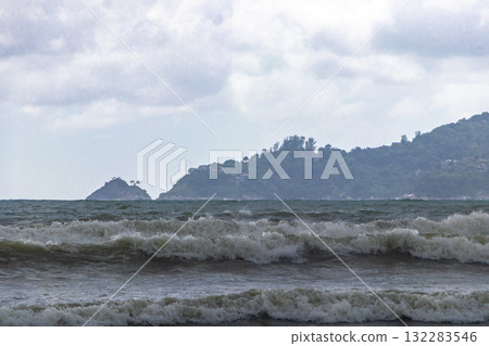 Storm heavy monsoon rain clouds wild waves Patong Beach Thailand. Storm heavy monsoon rain clouds wild waves Patong Beach Thailand. 132283546