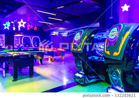 Colorfully illuminated arcade with slot machines and gaming devices Thailand. Colorfully illuminated arcade with slot machines and gaming devices Thailand. 132283621