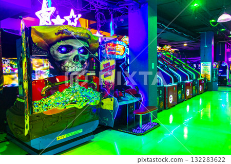 Colorfully illuminated arcade with slot machines and gaming devices Thailand. Colorfully illuminated arcade with slot machines and gaming devices Thailand. 132283622
