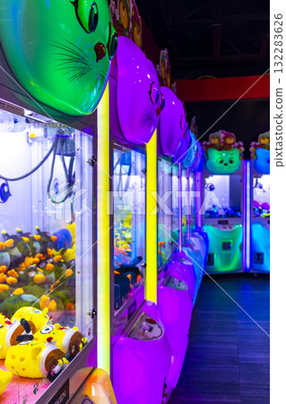 Colorfully illuminated arcade with slot machines and gaming devices Thailand. Colorfully illuminated arcade with slot machines and gaming devices Thailand. 132283626