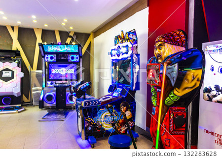 Colorfully illuminated arcade with slot machines and gaming devices Thailand. Colorfully illuminated arcade with slot machines and gaming devices Thailand. 132283628
