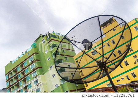 Satellite dish and apartment building in Patong Phuket Thailand. 132283761