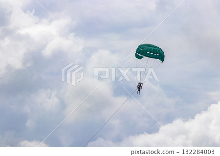 Patong Beach Phuket with turquoise blue water and parasailing Thailand. Patong Beach Phuket with turquoise blue water and parasailing Thailand. 132284003