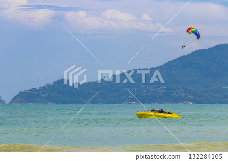 Patong Beach Phuket with turquoise blue water and parasailing Thailand. 132284105
