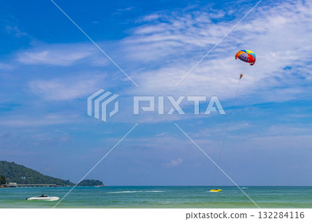 Patong Beach Phuket with turquoise blue water and parasailing Thailand. Patong Beach Phuket with turquoise blue water and parasailing Thailand. 132284116