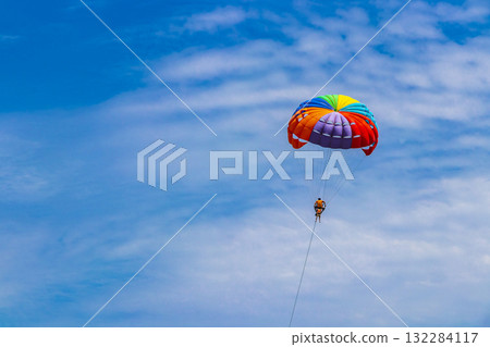 Patong Beach Phuket with turquoise blue water and parasailing Thailand. Patong Beach Phuket with turquoise blue water and parasailing Thailand. 132284117
