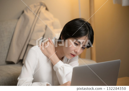 A woman who can't finish her work and ends up working from home 132284350