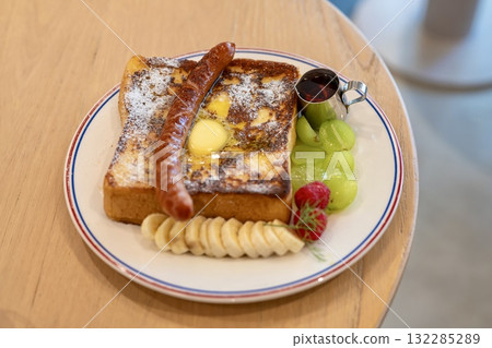 Cafe French toast with sausage and fruit 132285289