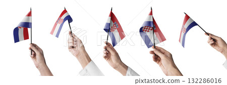 The Croatia flag in hand in different angles on a white background The Croatia flag in hand in different angles on a white background 132286016