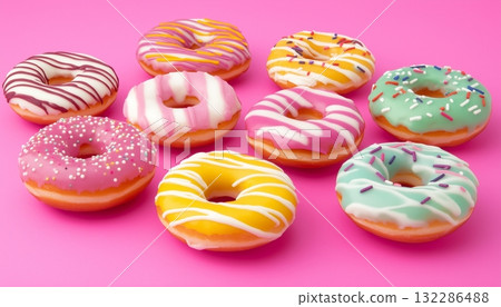 Colorful toping cream donuts sweet snack food on pink background Colorful toping cream donuts sweet snack food on pink background 132286488