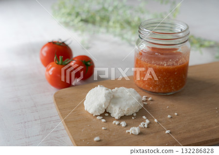 A jar of tomato koji and the rice koji ingredient 132286828
