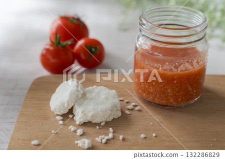 A jar of tomato koji and the rice koji ingredient 132286829