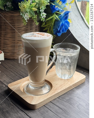 Hot Cappuccino in a Clear Glass Mug 132287514