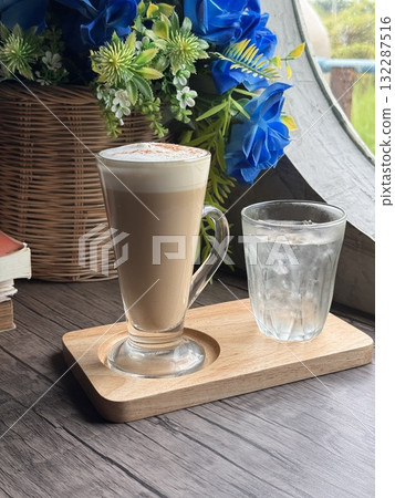 Hot Cappuccino in a Clear Glass Mug 132287516