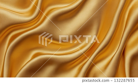 Luxurious golden silk fabric with smooth flowing texture Luxurious golden silk fabric with smooth flowing texture 132287655