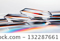 Colorful refraction in clear prism shapes reflecting rainbow spectrum 132287661