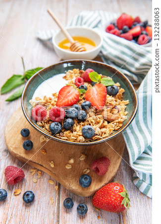 Healthy breakfast granola with fresh berries and honey Healthy breakfast granola with fresh berries and honey 132288063