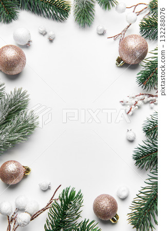 Christmas frame with pine branches and ornaments on white background Christmas frame with pine branches and ornaments on white background 132288076