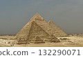 Three pyramids stacked diagonally, a dynamic desert landscape and a composition for travel promotion 132290071