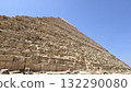Directly below the pyramid towering against the blue sky - Magnificent desert architecture for travel advertising 132290080