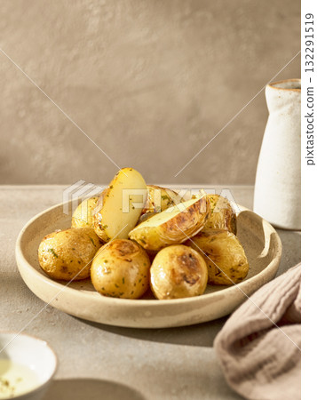 plate of roasted potatoes 132291519