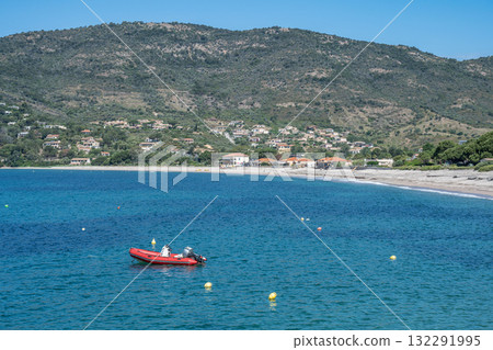 Spectacular view Golf at Sagone Corsica France beautyful sand Beach boats mountain village Tourism and vacations concept 132291995