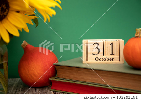 Autumn background with pumpkins. Wooden calendar showing October 31.Halloween concept. 132292161