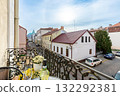 Balcony View of Old Town Street with Wine Bottle and Flowers 132292381