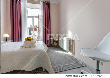 Bright Bedroom with Balcony and Pink Curtains in Modern Apartment 132292388